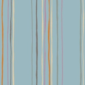 Multicolored Hand Drawn Irregular Vertical Stripes on a Light Blue base