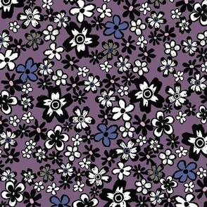 Block printed overall tossed floral flower botanical field in black and white with touches of dark warm gray, pink, navy blue and sage green on an eggplant violet  base