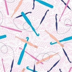 Crochet Hooks of Pink, Teal, Navy and Orange on a Pink Doily Textured Background