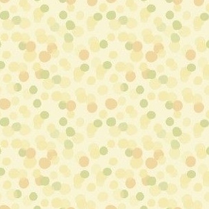 Pastel yellow and green dots.  Random pattern like floating bubbles.