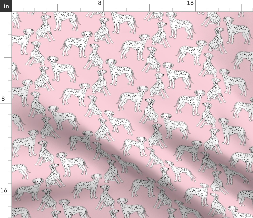 Cute dalmatians on pink background