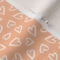 (S) Ivory freehand hearts on peach fuzz