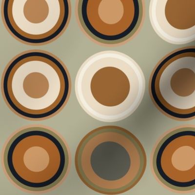 Circles in beige, copper brown, tan brown, black on sage green