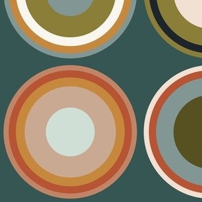 Circles in taupe brown, grey, beige, olive green, orange, salmon red, apricot on dark gray