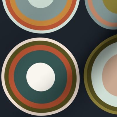 Circles in taupe brown, grey, beige, olive green, orange, salmon red, apricot on charcoal black