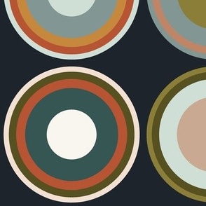 Circles in taupe brown, grey, beige, olive green, orange, salmon red, apricot on charcoal black