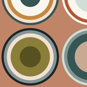 Circles in taupe brown, grey, beige, olive green, orange, salmon red, apricot on salmon orange