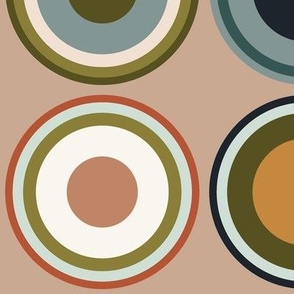 Circles in tangerine orange, terra cotta, grey, black, white, apricot brown on desert sand brown