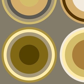 Circles in grey, white, brown, olive green on tan brown