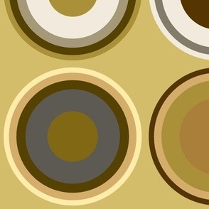 Circles in grey, white, brown, olive green, yellow on buff brown