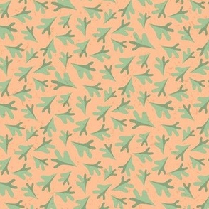 Tossed Two Tone Leaves in Soft Pastel Green on Pantone Peach Fuzz  Ground with Faux Texture Small  Scale