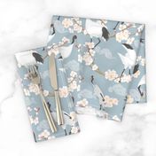 Cranes and cherry blossoms in blue background