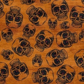Spooky skulls with glowing red eyes on orange background