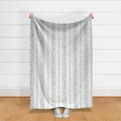 vintage dusty blue floral and ribbon stripe on textured creamy background 