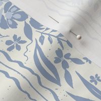 vintage dusty blue floral and ribbon stripe on textured creamy background 