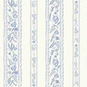 vintage dusty blue floral and ribbon stripe on textured creamy background 