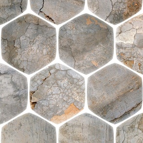 Large, rustic industrial texture behind a white glowing hex-grid