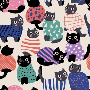 Cats In Patterned Sweaters