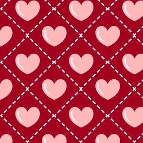 Quilted Pink Hearts on a Red Background