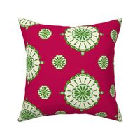 Geometric block print blooms in red & green featuring circles of poppy seeds florets for nature-inspired living decor, wallpaper & bedding