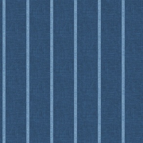 1/2" wide chambray denim pencil stripes on an indigo blue, faux denim woven textured background. 
