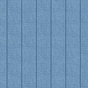 Indigo denim pin stripes on a 4" wide chambray blue, faux denim woven textured background. 