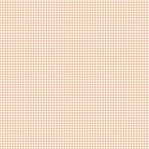 Peach polka dots on a white background