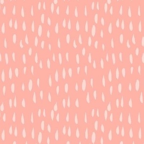 Creamy raindrops on a peachy pink background