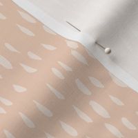 Creamy raindrop speckle on pantone peach fuzz background for home decor