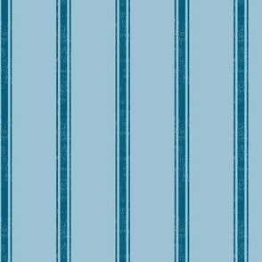 Traditional Vertical Ticking Stripe in Medium Blue and Dark Blue.