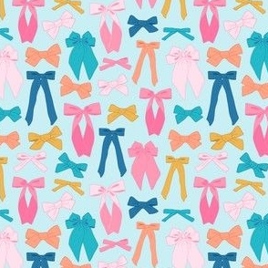 Cute and colorful bows on light blue