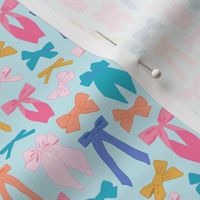 Cute and colorful bows on light blue