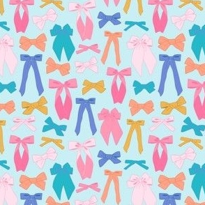 Cute and colorful bows on light blue