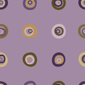 Hand painted organic, concentric circles in a grid pattern in shades of pale lilac and purple, soft yellow golds and mustard on a dusky lavender background. A lovely bedroom wallpaper.