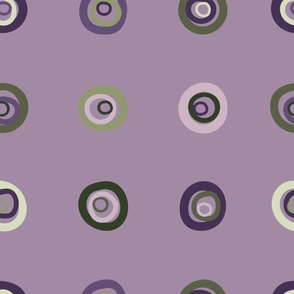 Hand painted organic, concentric circles in a grid pattern in shades of pale lilac and purple, soft mint and greens on a dusky lavender background. A lovely bedroom wallpaper.