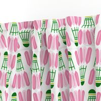 Badminton shuttlecocks in preppy-inspired pink and green on white