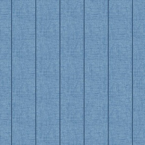 Indigo denim pin stripes on a 2" wide chambray blue, faux denim woven textured background. 