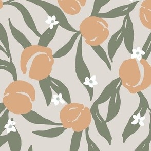 Tossed peach fruit with leaves and flowers in beige orange and green