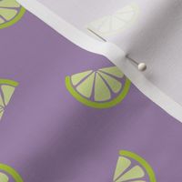 Retro style citrus slices lime green on lilac 