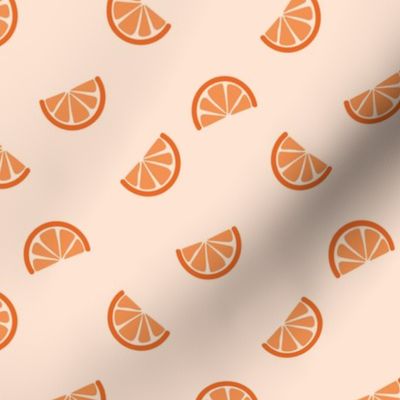 Retro style citrus slices oranges on cream sand 