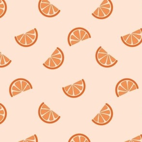 Retro style citrus slices oranges on cream sand 