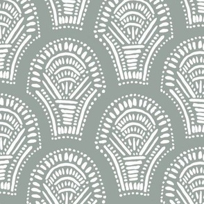 Scalloped geometric block print with a hand drawn feel in dark teal and white