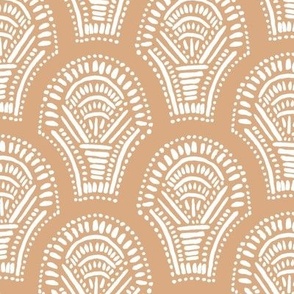 Scalloped geometric block print with a hand drawn feel in peachy orange and white