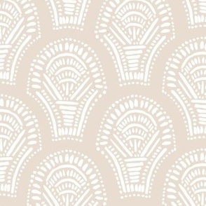Scalloped geometric block print with a hand drawn feel in light peach and white