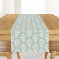 Scalloped geometric block print with a hand drawn feel in light teal and white