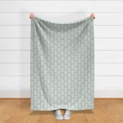 Scalloped geometric block print with a hand drawn feel in light teal and white