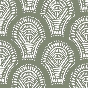 Scalloped geometric block print with a hand drawn feel in dark green and white