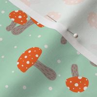 Fly agaric mushrooms on mint green, cute forest amanita mushrooms on light green