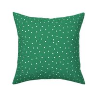 White polka dots on St Patricks Day green 