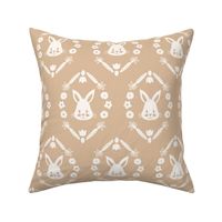 large easter bunnies in floral ovals in eggshell off white on light brown